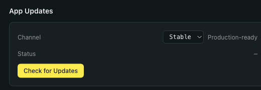 Settings → About → App Updates panel zoomed in. Channel dropdown set to Stable with the helper text 'Production-ready' next to it. A Status row underneath. A yellow Check for Updates button at the bottom of the panel.