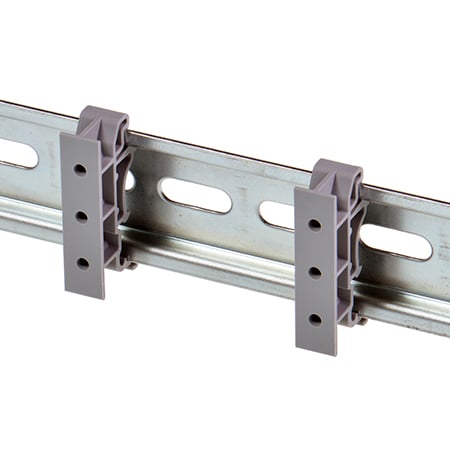 MK-048 mounting clips attached to DIN rail showing three adjustable screw holes
